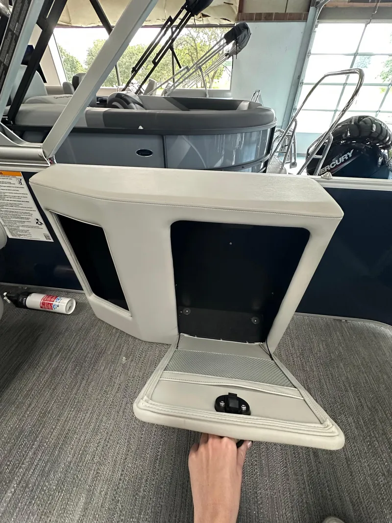 Slide: The Image of 2025 Godfrey Sweetwater 2286 C SPEC EDI TRI boat interior storage compartment. - 14