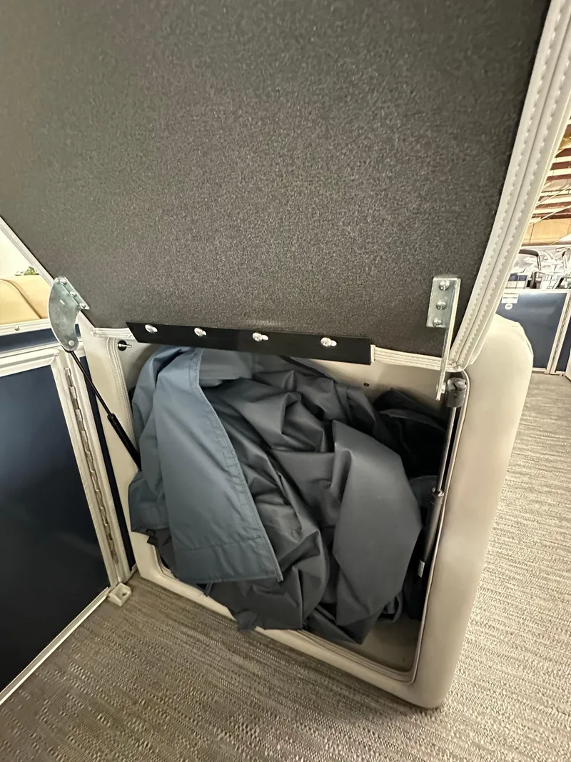 Slide: The Image of Open storage compartment in 2025 Godfrey Sweetwater 2286 C pontoon boat. - 15