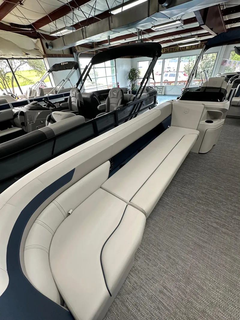 Slide: The Image of 2025 Godfrey Sweetwater 2286 C SPEC EDI TRI pontoon boat interior with plush seating. - 3