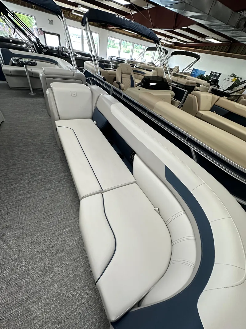 Slide: The Image of 2025 Godfrey Sweetwater 2286 C pontoon boat interior with plush seating. - 4
