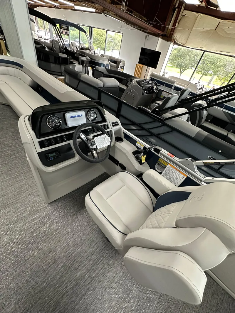 Slide: The Image of 2025 Godfrey Sweetwater 2286 C SPEC EDI TRI pontoon boat interior with modern dashboard and seating. - 7