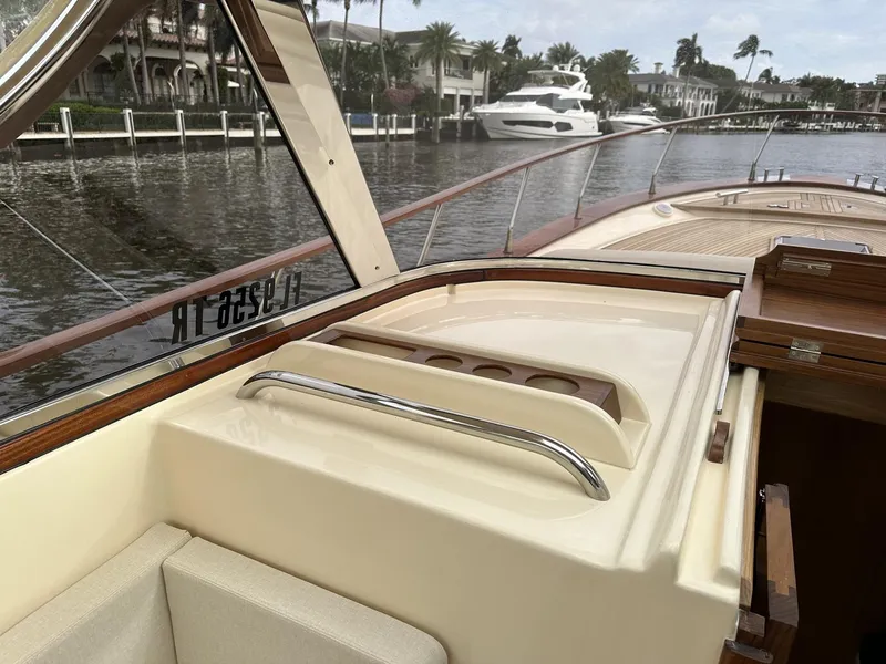 Slide: The Image of Fratelli Aprea Sorrento Cabinatto 32, 2023 model, docked by waterfront homes. - 11