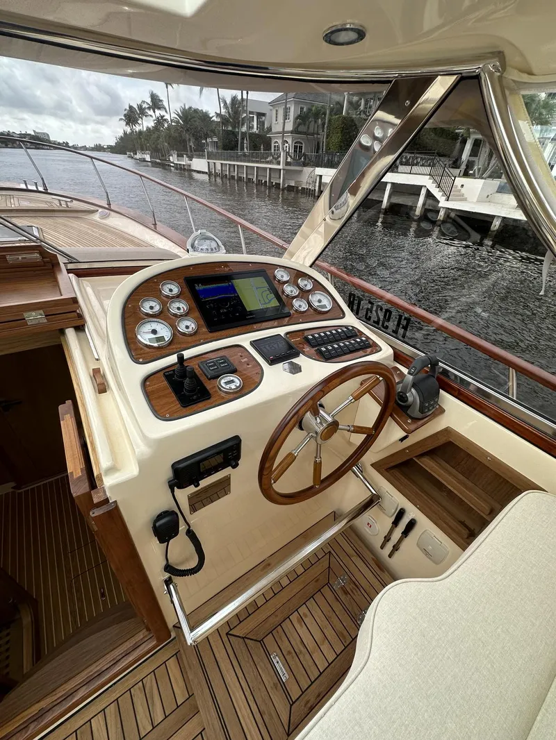 Slide: The Image of 2023 Fratelli Aprea Sorrento Cabinatto 32 yacht helm station with wooden accents. - 13
