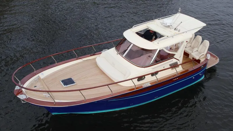 Slide: The Image of 2023 Fratelli Aprea Sorrento Cabinatto 32 boat on water, top view. - 2