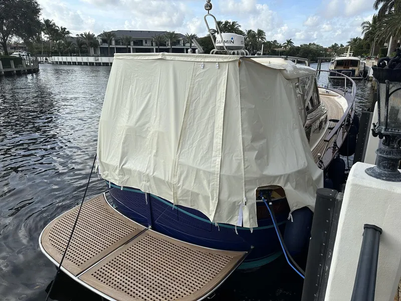 Slide: The Image of 2023 Fratelli Aprea Sorrento Cabinatto 32 docked with cover, rear view. - 21