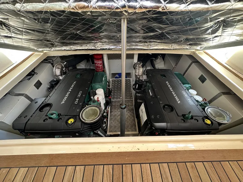Slide: The Image of Fratelli Aprea Sorrento Cabinatto 32 engine compartment, 2023 model, featuring dual Volvo Penta engines. - 32