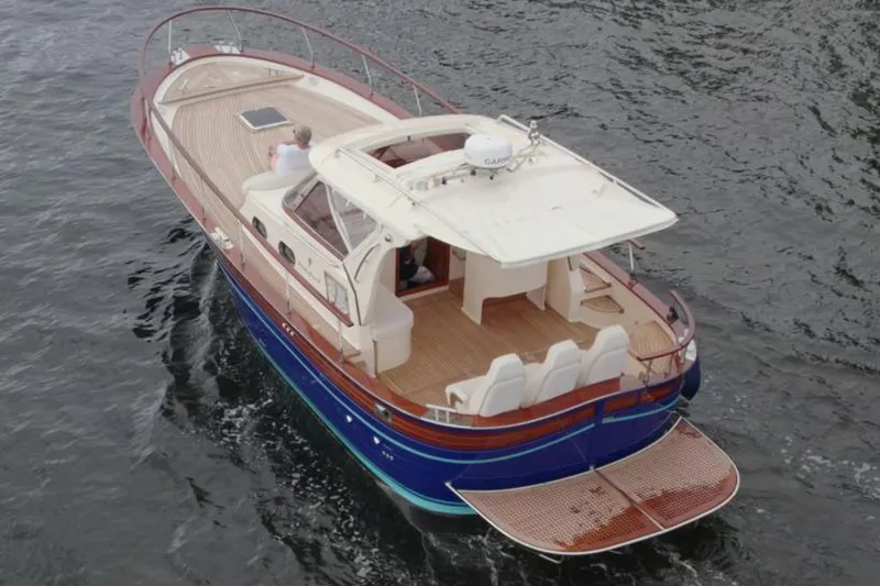 Slide: The Image of 2023 Fratelli Aprea Sorrento Cabinatto 32 luxury boat cruising on water. - 4