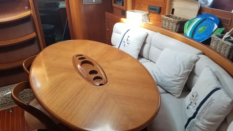 Slide: The Image of Engine room of a 2003 CNB 64 yacht, featuring mechanical equipment and wiring. - 12