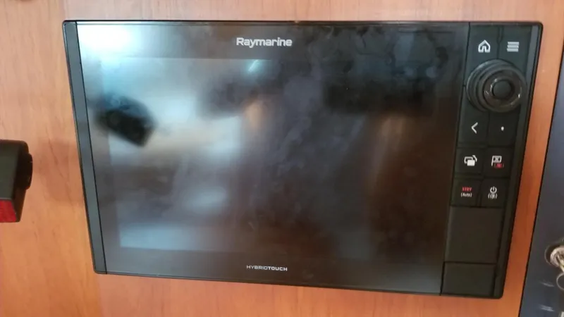 Slide: The Image of Deck view of 2003 CNB 64 yacht with covered cockpit and wooden flooring. - 18