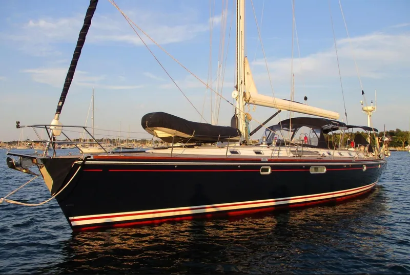 Slide: The Image of Electrical panel with battery switches and circuit breakers on a 2003 CNB 64 yacht. - 27