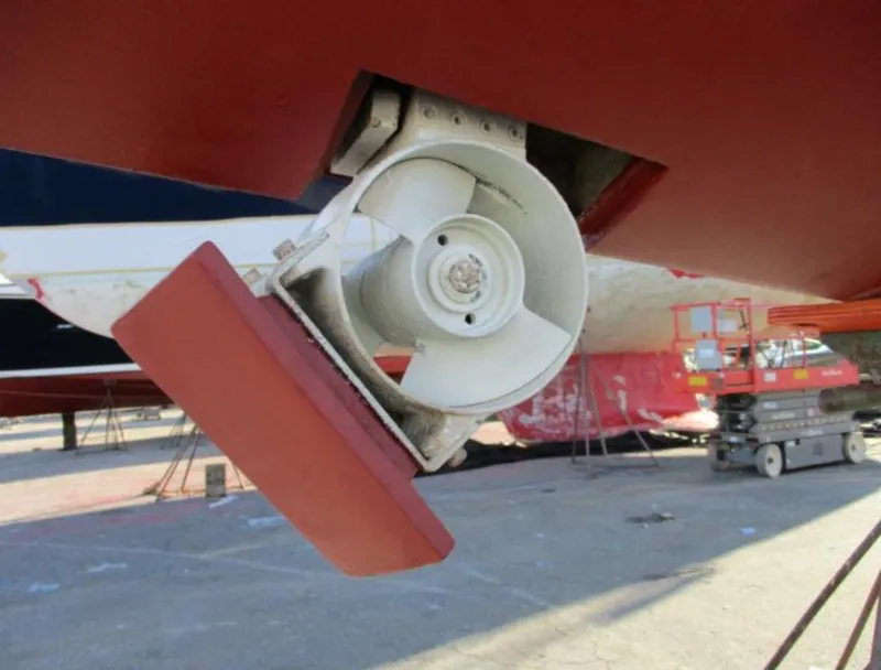 Slide: The Image of Galley kitchen in 2003 CNB 64 yacht with wood cabinetry and stainless steel appliances. - 35