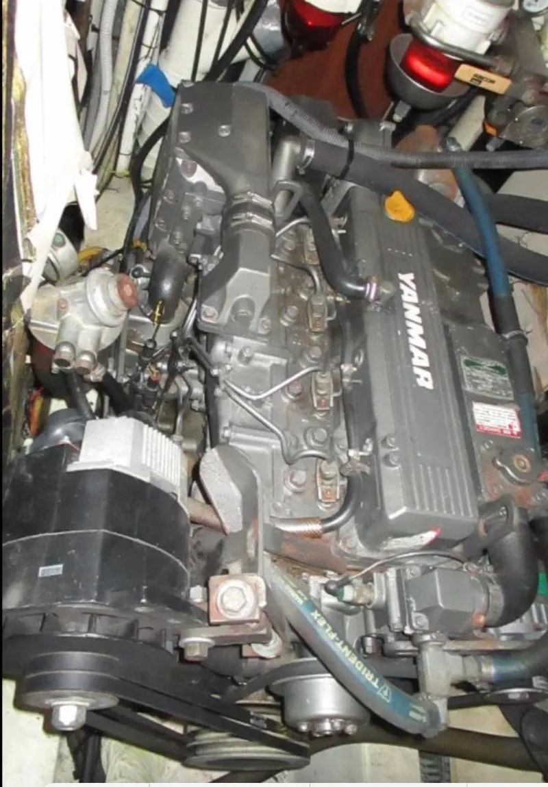 Slide: The Image of Engine compartment of a 2003 CNB 64 yacht with Yanmar engine. - 38