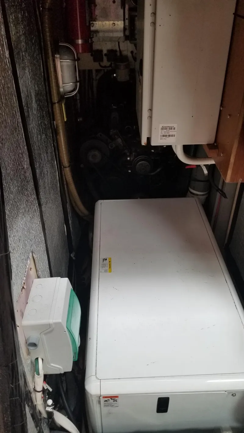 Slide: The Image of Cozy cabin interior of 2003 CNB 64 yacht with bed and reading lights. - 4