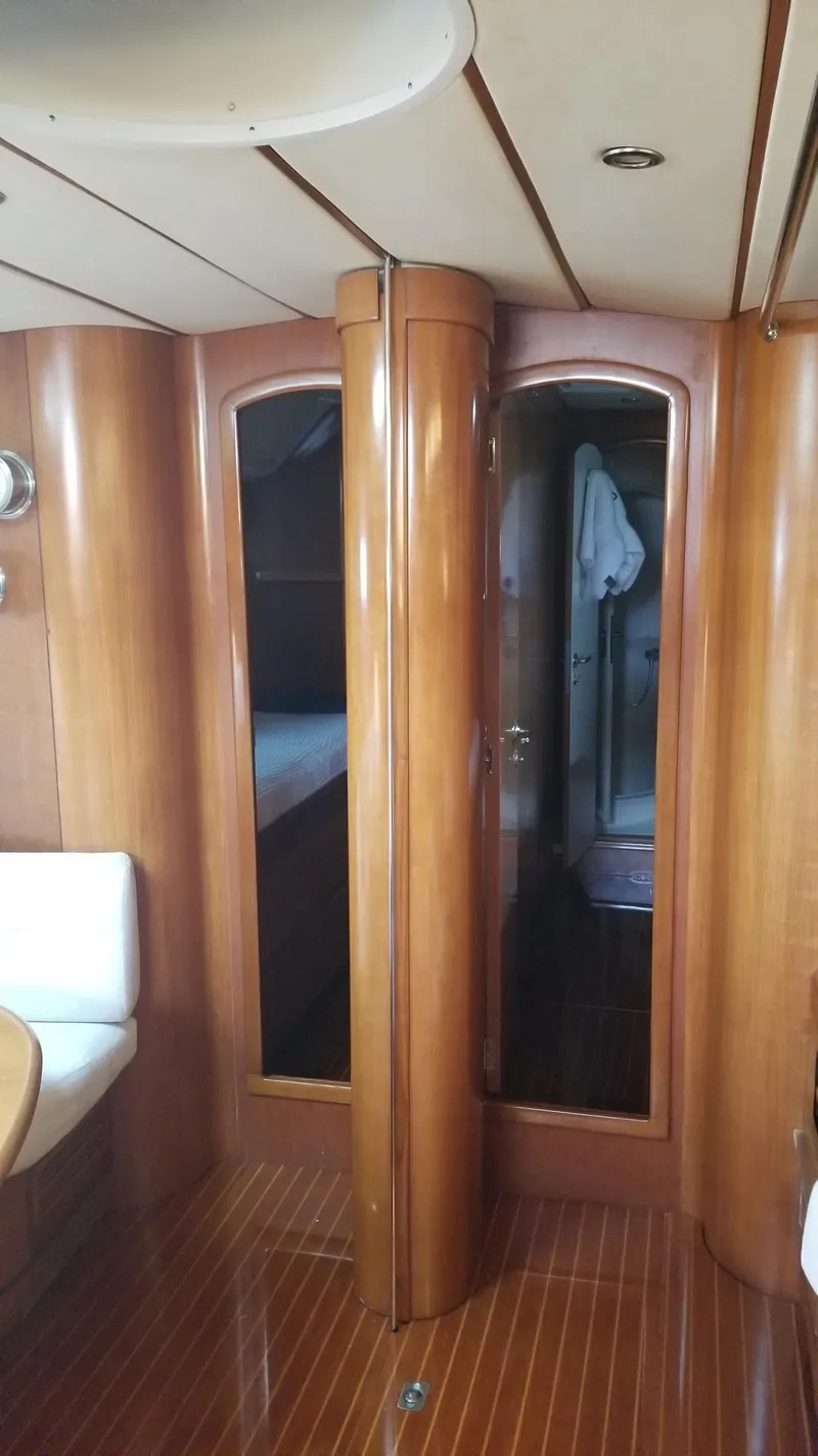 Slide: The Image of Luxurious CNB 64 yacht interior with cozy seating and nautical-themed decor. - 7