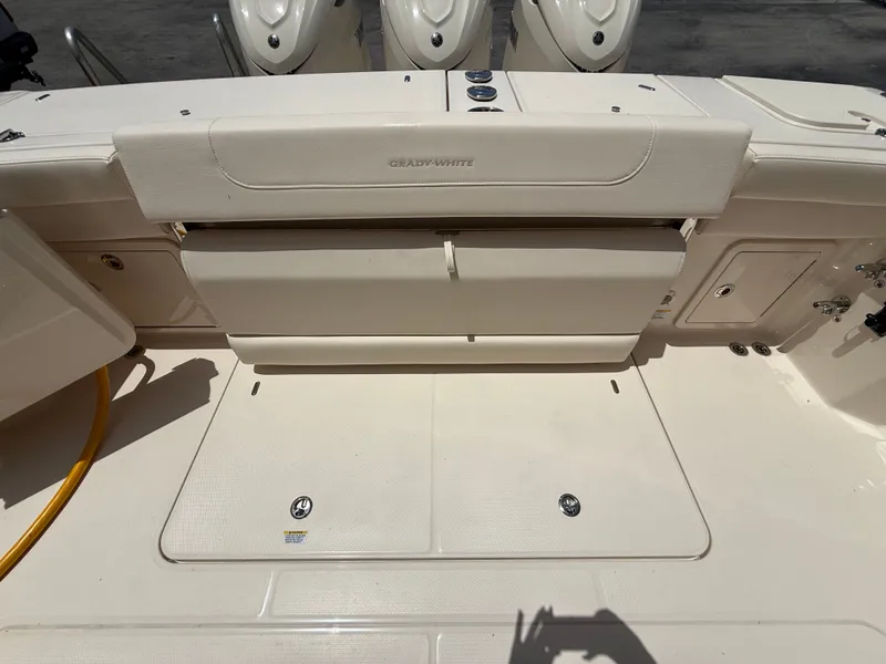Slide: The Image of The image shows the cockpit of a Grady-White Express 340 boat with storage and engines. - 7