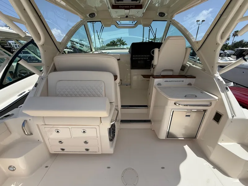 Slide: The Image of The 2026 Grady-White Express 340 cockpit features luxurious seating and modern controls. - 13