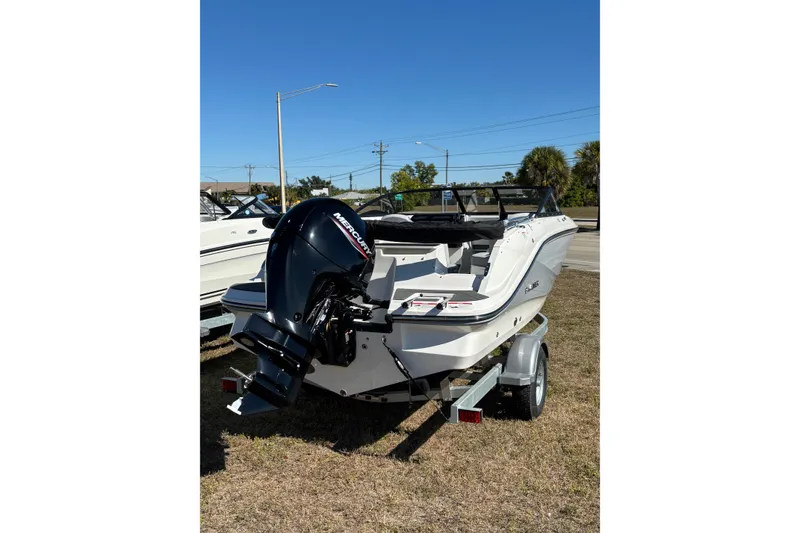 Slide: The Image of 2025 Bayliner VR5 Bowrider OB on trailer, featuring a powerful outboard motor. - 10