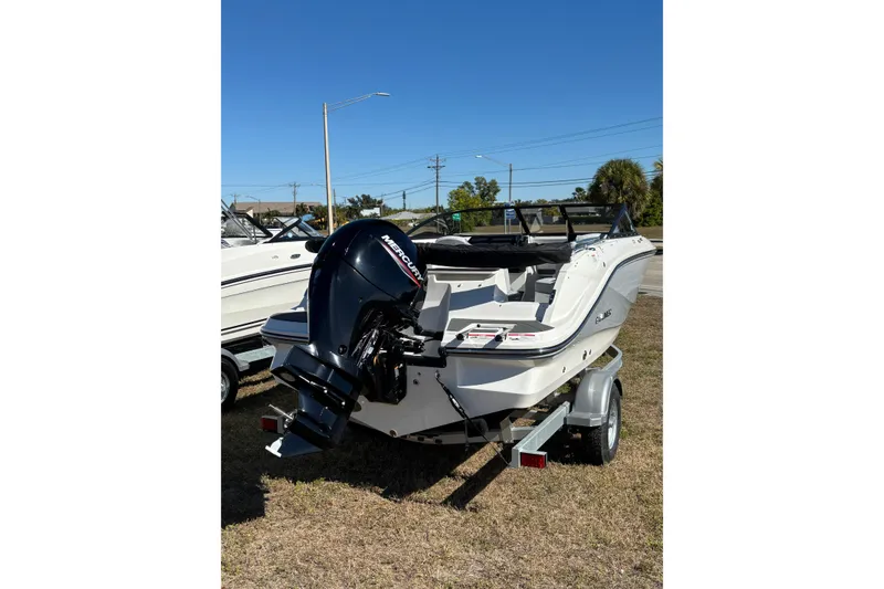 Slide: The Image of 2025 Bayliner VR5 Bowrider OB on trailer, featuring a powerful outboard motor. - 11