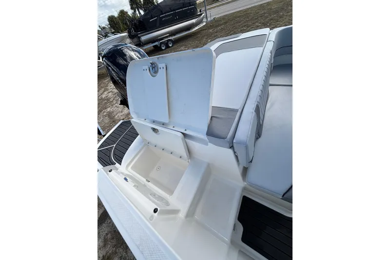 Slide: The Image of 2025 Bayliner VR5 Bowrider OB interior with seating and storage compartments. - 15