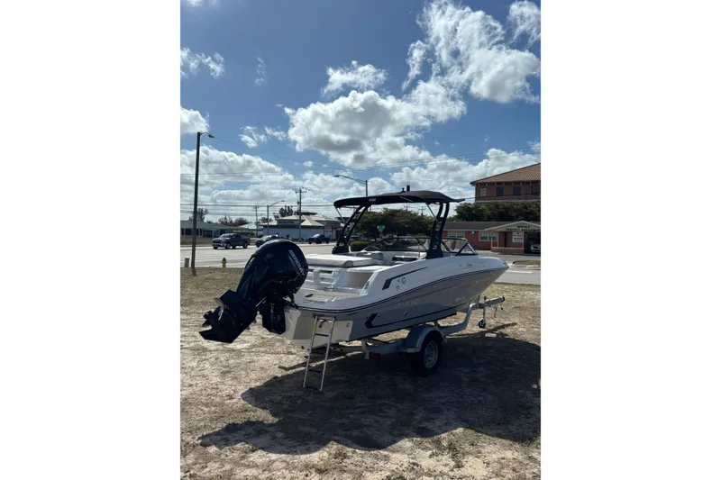 Slide: The Image of 2025 Bayliner VR5 Bowrider OB on trailer under a partly cloudy sky. - 18