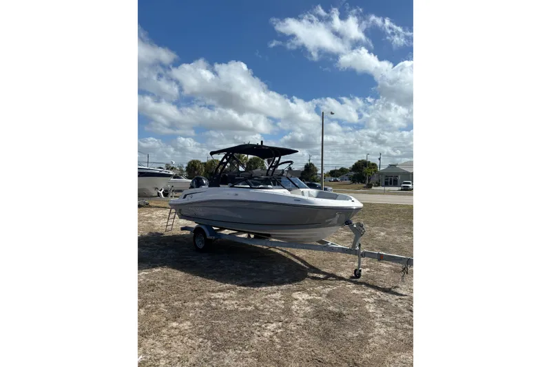 Slide: The Image of 2025 Bayliner VR5 Bowrider OB on trailer under blue sky. - 19