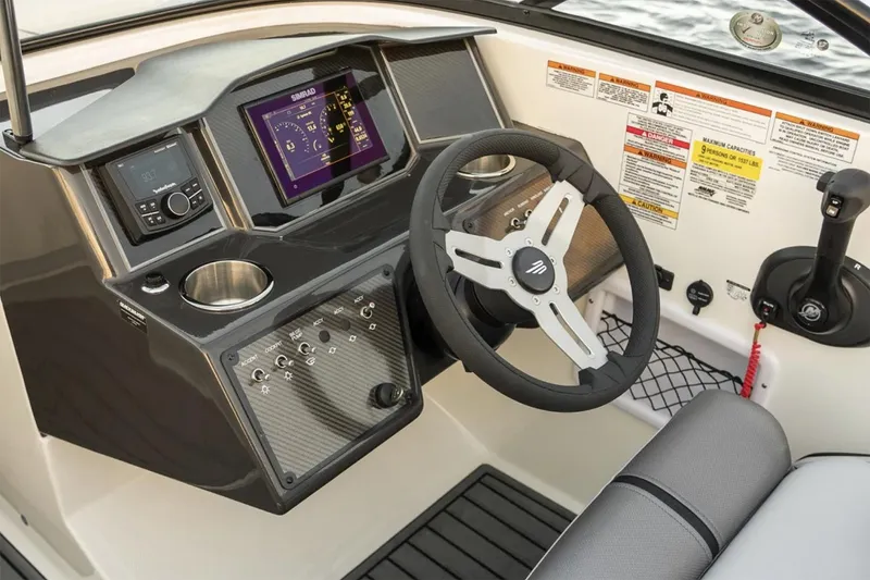 Slide: The Image of 2025 Bayliner VR5 Bowrider OB boat interior with open bow seating and sleek design. - 5