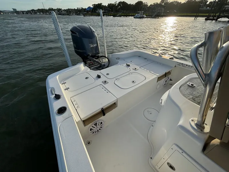 Slide: The Image of 2017 Sea Hunt BX 25 BR boat with Yamaha 300 engine on calm water at sunset. - 10