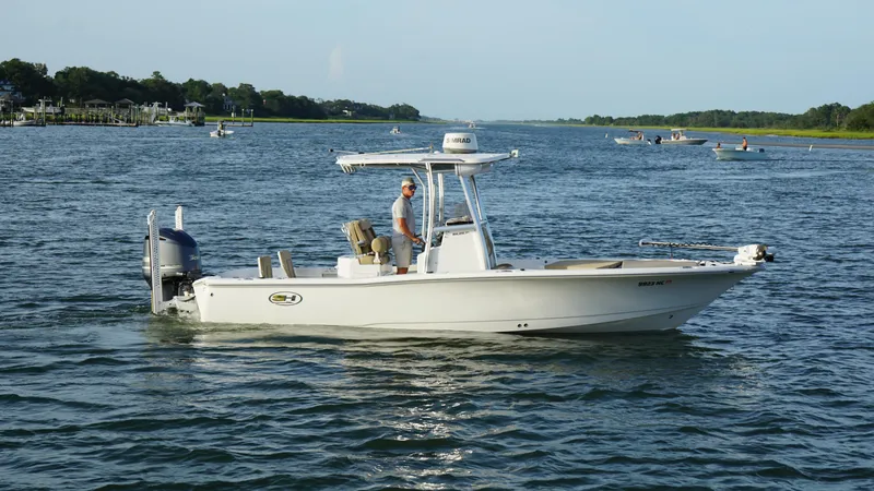 Slide: The Image of 2017 Sea Hunt BX 25 BR boat cruising on a calm river. - 3