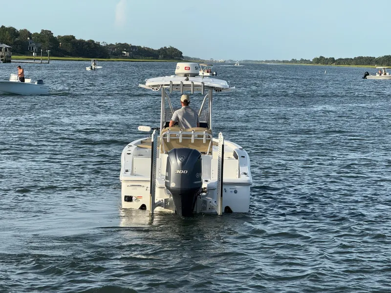 Slide: The Image of 2017 Sea Hunt BX 25 BR boat cruising on a scenic waterway. - 4