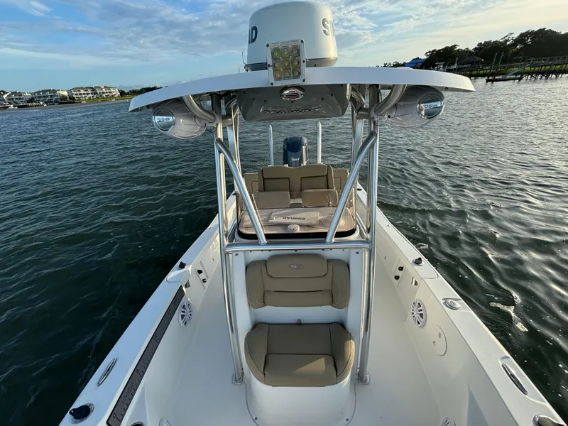 Slide: The Image of 2017 Sea Hunt BX 25 BR boat on water, featuring spacious seating and modern design. - 9