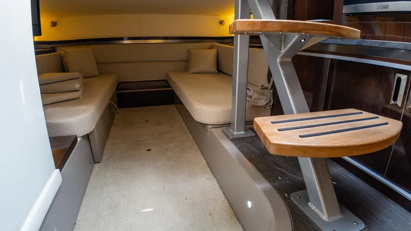Slide: The Image of Interior of 2019 Sea Ray Sundancer 320, featuring cozy seating and modern design elements. - 44