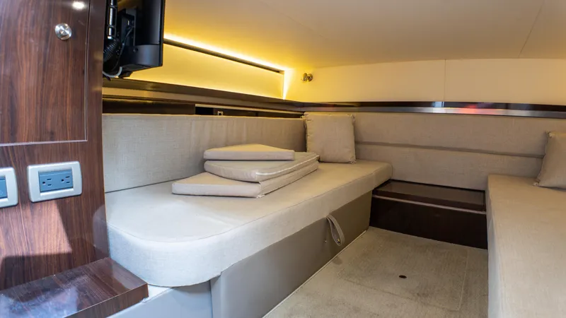 Slide: The Image of Interior cabin of 2019 Sea Ray Sundancer 320 with beige seating and modern lighting. - 46