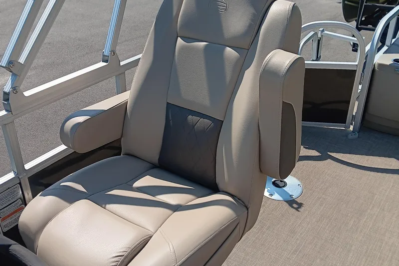 Slide: The Image of 2021 Sun Tracker Fishin' Barge 20 DLX captain's chair, beige upholstery, armrests, and sturdy frame. - 10