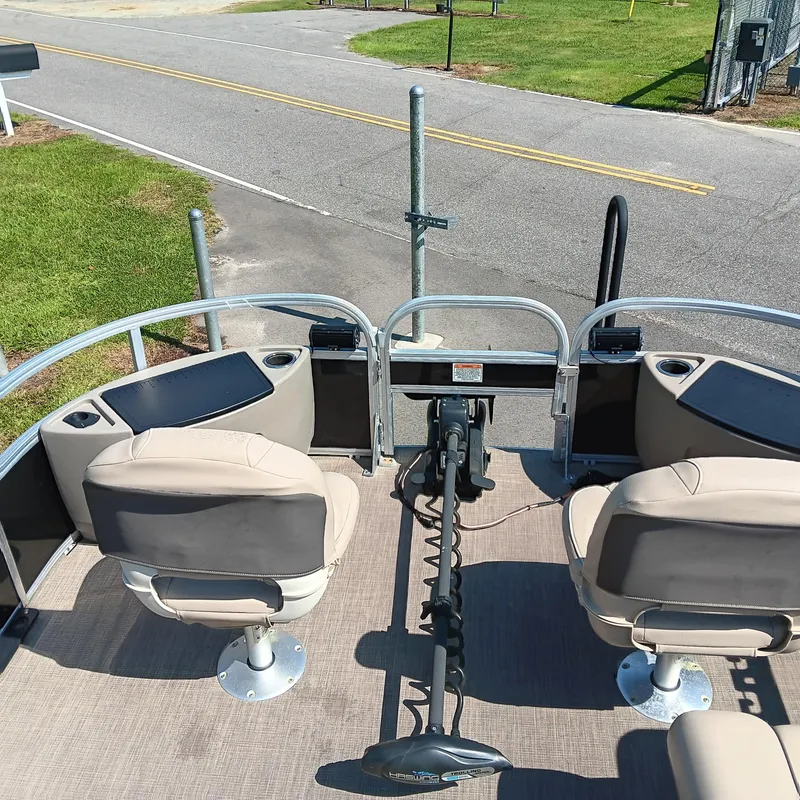 Slide: The Image of 2021 Sun Tracker Fishin' Barge 20 DLX with fishing seats and trolling motor. - 6