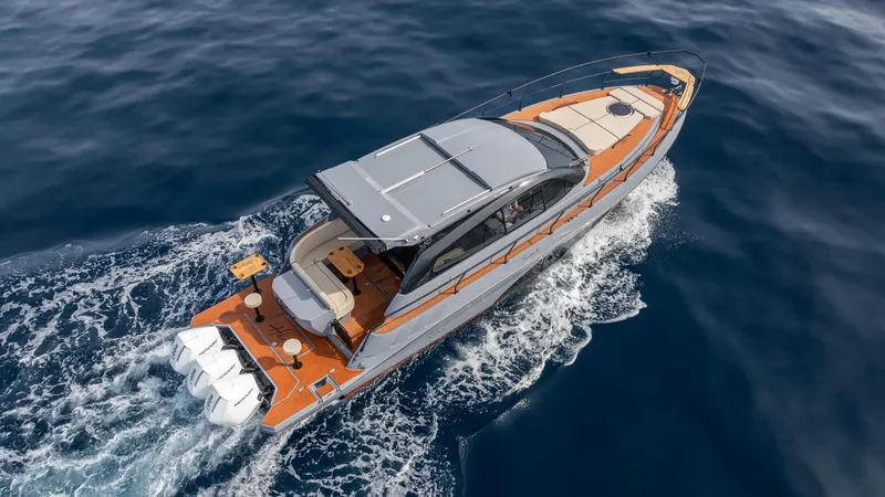 Slide: The Image of Luxurious 2025 Hanover 415 yacht cruising on open sea, showcasing sleek design and powerful engines. - 10