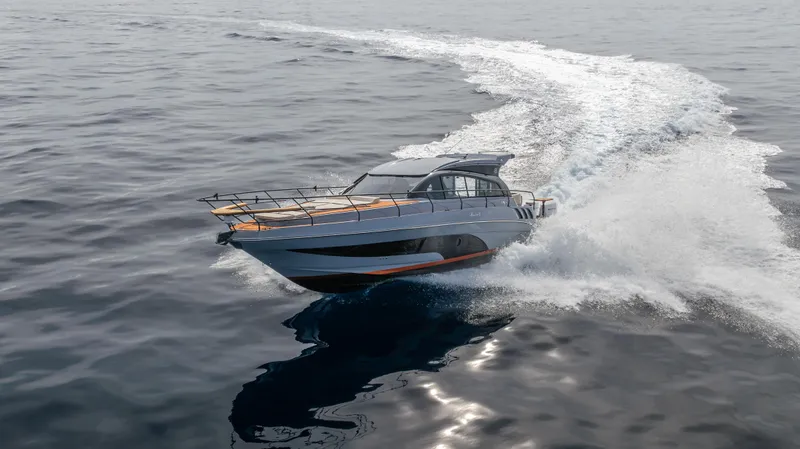 Slide: The Image of 2025 Hanover 415 yacht cruising on open water, creating a dynamic wake. - 22