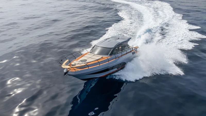 Slide: The Image of 2025 Hanover 415 yacht cruising on open water, creating a dynamic wake. - 23