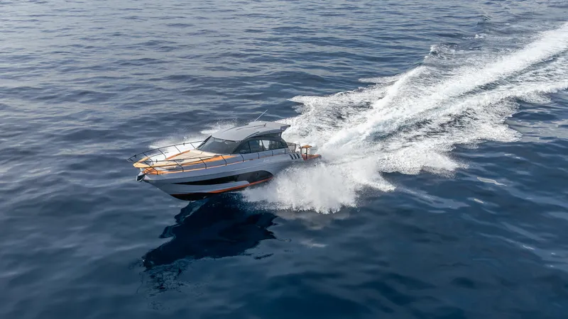 Slide: The Image of Hanover 415 boat speeding on open water, 2025 model. - 25