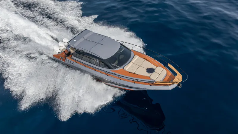 Slide: The Image of 2025 Hanover 415 yacht cruising on open water, top view. - 28