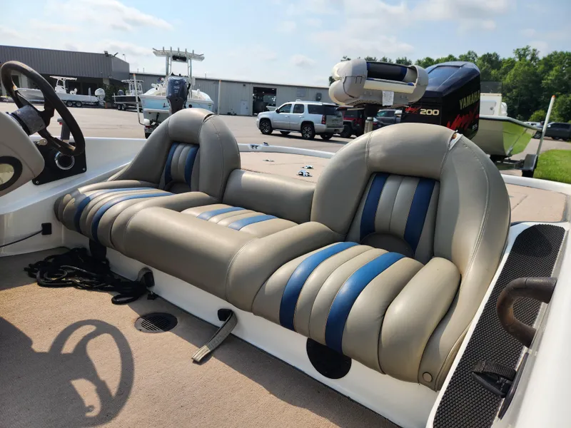 Slide: The Image of 2003 Ranger 195SVS boat interior with dual cushioned seats and steering wheel. - 12