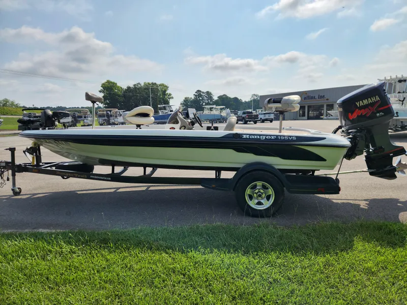Slide: The Image of 2003 Ranger 195SVS boat with Yamaha engine on trailer, parked outdoors. - 5