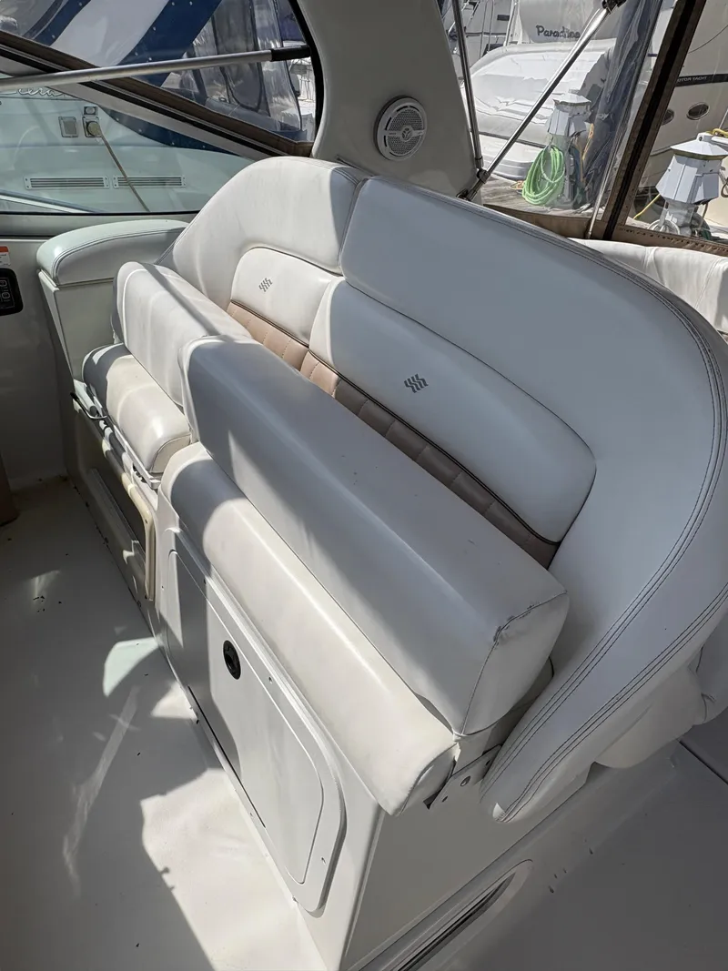 Slide: The Image of 2005 Four Winns 328 Vista Cruiser interior with white cushioned seating. - 2