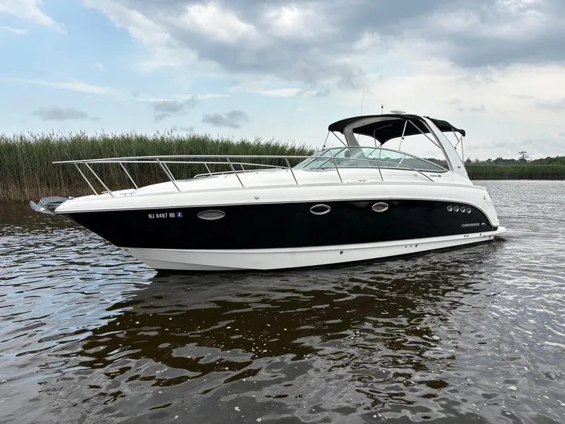 The Image of Chaparral Signature 350 boat, 2006 model, displayed on stands in a marina. - 0