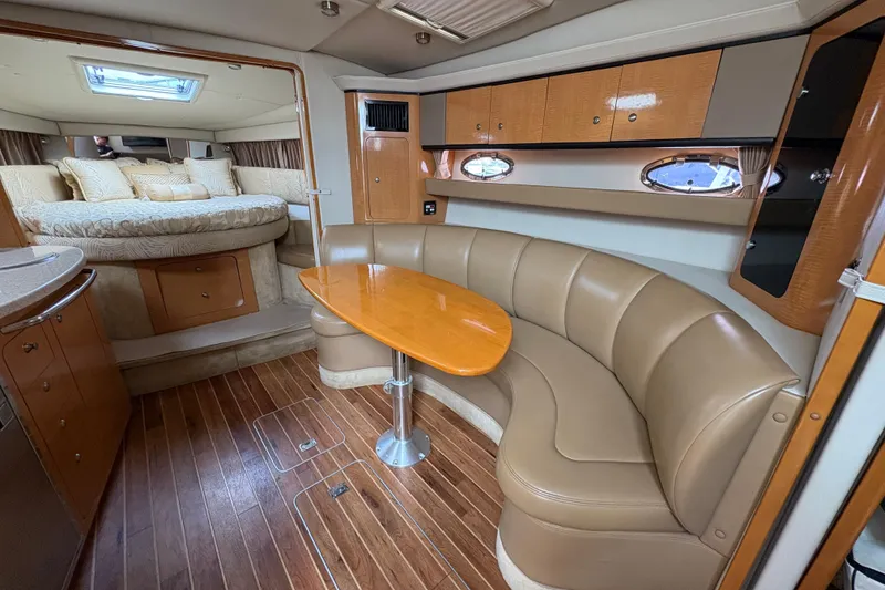 Slide: The Image of 2006 Chaparral Signature 350 boat docked near waterfront homes. - 10