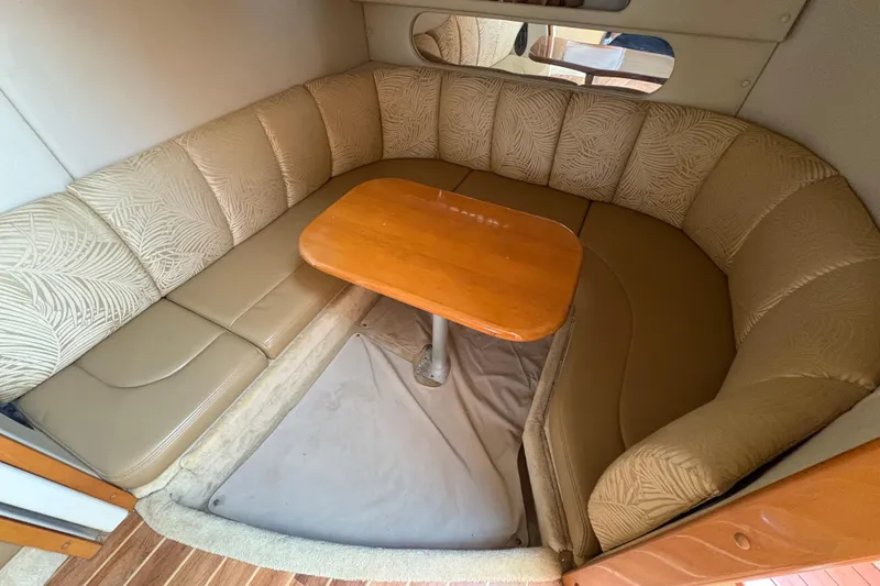 Slide: The Image of 2006 Chaparral Signature 350 boat interior with seating and table setup. - 11