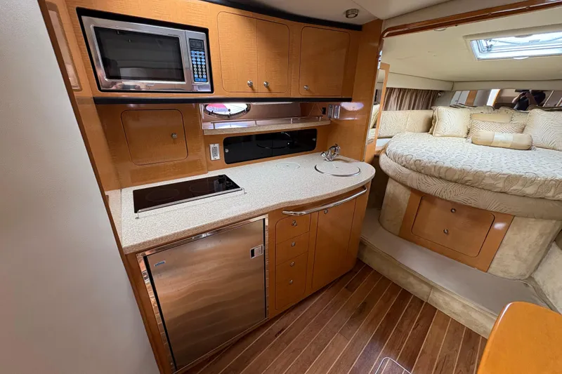 Slide: The Image of 2006 Chaparral Signature 350 boat interior with curved seating and sleek design. - 13