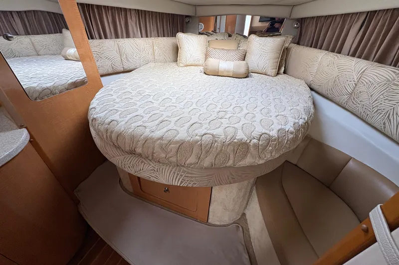 Slide: The Image of 2006 Chaparral Signature 350 boat interior with white seating and modern dashboard controls. - 14