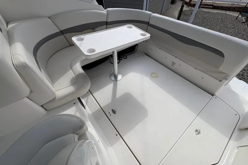 Slide: The Image of 2006 Chaparral Signature 350 yacht docked in a scenic waterfront setting. - 6