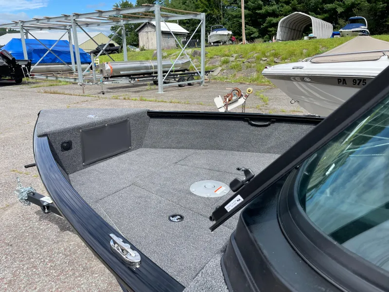 The Image of 2026 Lund 1675 Adventure Sport boat interior at a marina. - 1