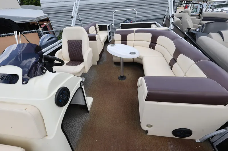Slide: The Image of 2021 Lexington 525 cc pontoon boat with spacious seating and modern helm. - 12